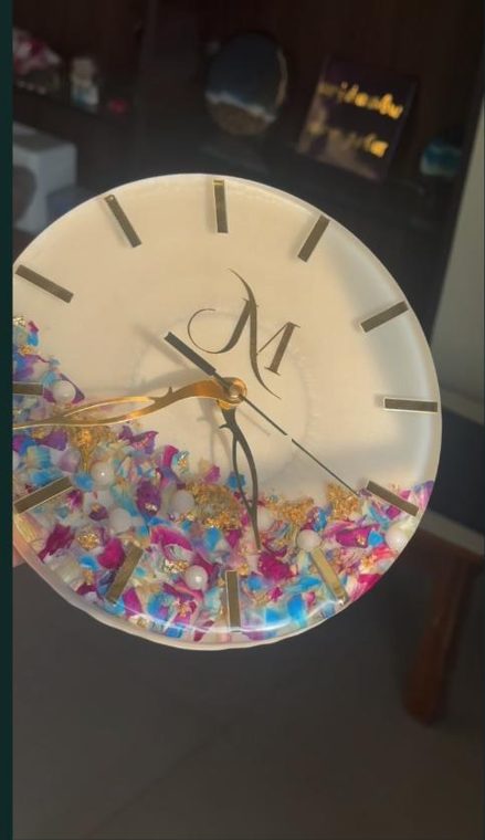 Resin wall clock with flower petals, gold leaf and a monogram